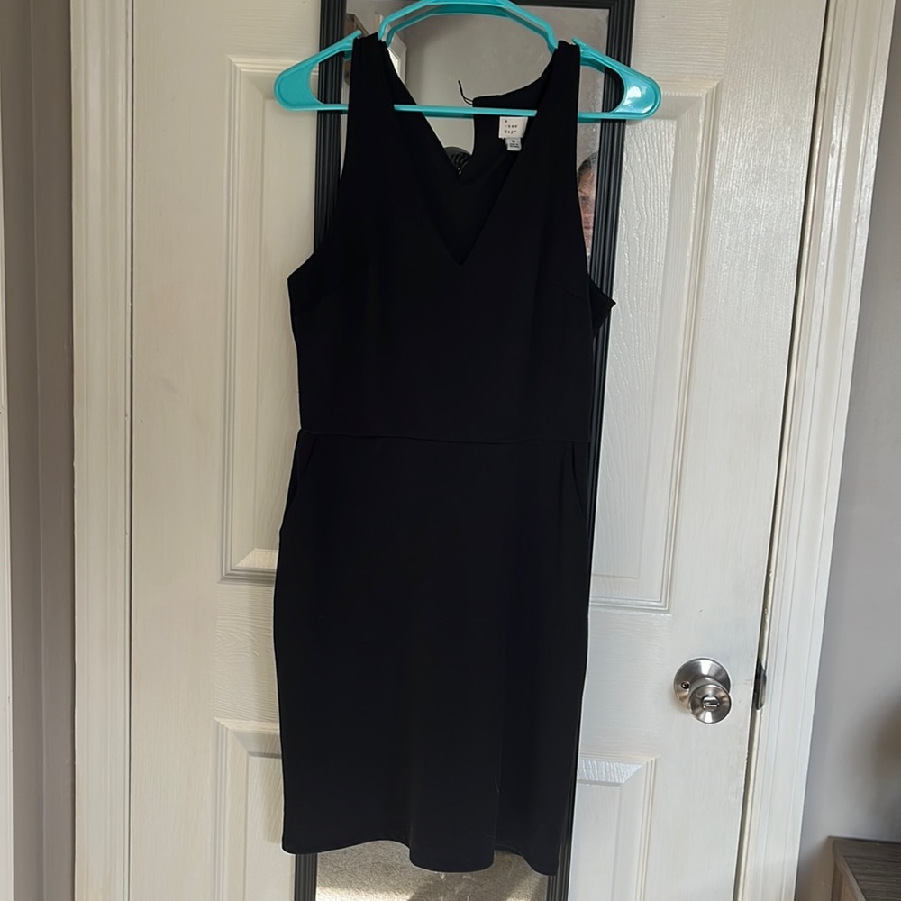 Knee length black business dress with pockets